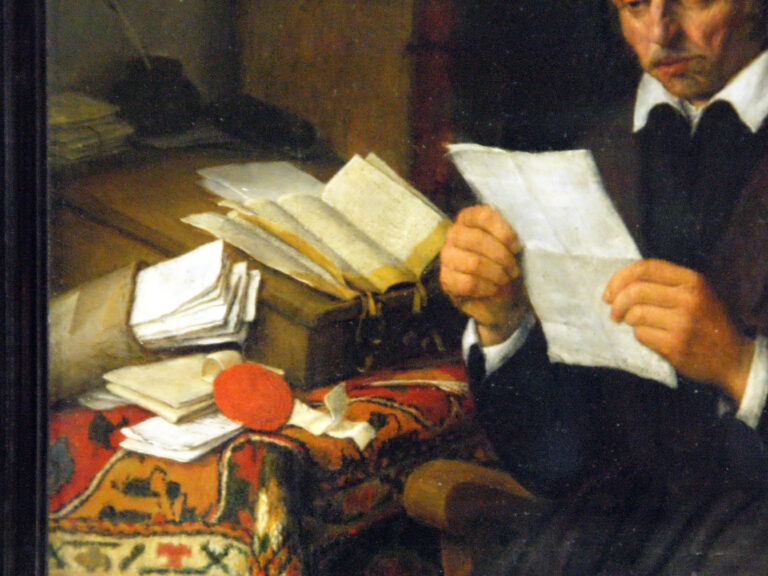 persona leyendo documentos con sello oficial